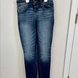 Buckle black dark washed jeans.